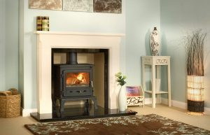 Firefox 8.1 Multi-Fuel Stove with 54" Sienna Mantel, Reeded Fireboard Chamber, Granite Slip Set, 54" Slabbed Granite Hearth and Slabbed Granite Back Hearth