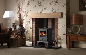 Classic 5 Clean Burn Stove Shown with Rustic Brick Chamber with Front Returns, 48" Slabbed Granite Hearth & Back Hearth and 48" Rustic Light Oak Effect Geocast Beam