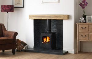 Helios 5 Clean Burn Stove Shown with Staggered Black Slate Block Chamber, 48" Slabbed Honed Granite Hearth & Back Hearth and 48" Rustic Light Oak Effect Geocast Beam