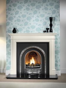 Bartello 54" Agean limestone mantel with highlight Lytton arched insert, decorative gas fire with ceramic coals and 54" granite hearth